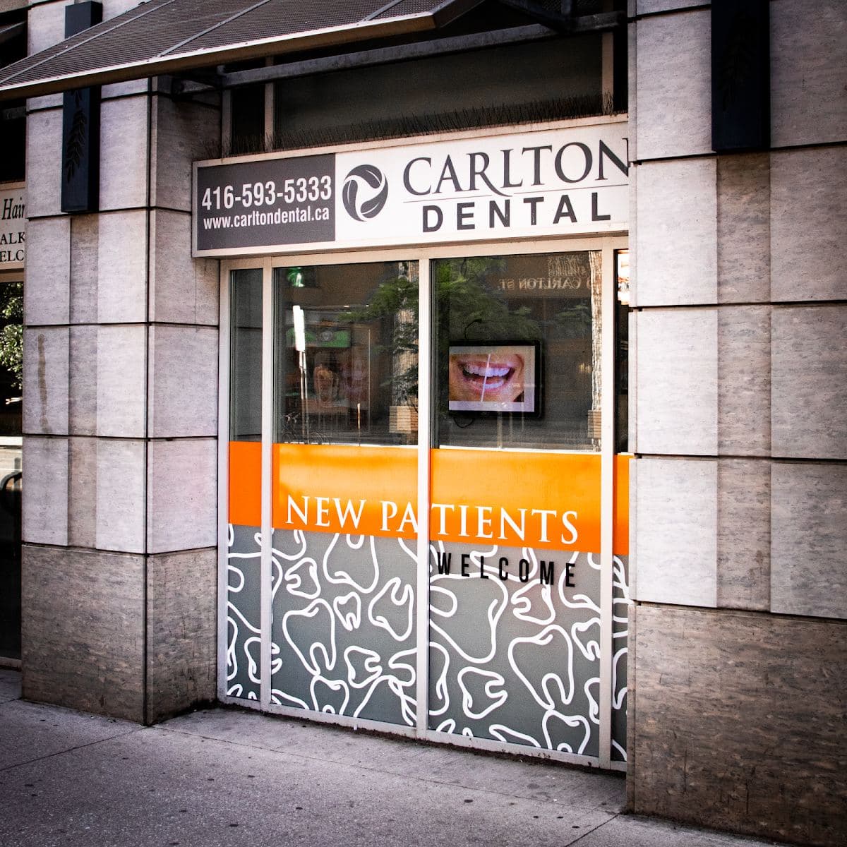 Carlton Dental dentist office entrance at 25 Carlton Street in downtown Toronto, steps from College Station Carlton Dental dentist office entrance at 25 Carlton Street in downtown Toronto, steps from College Station